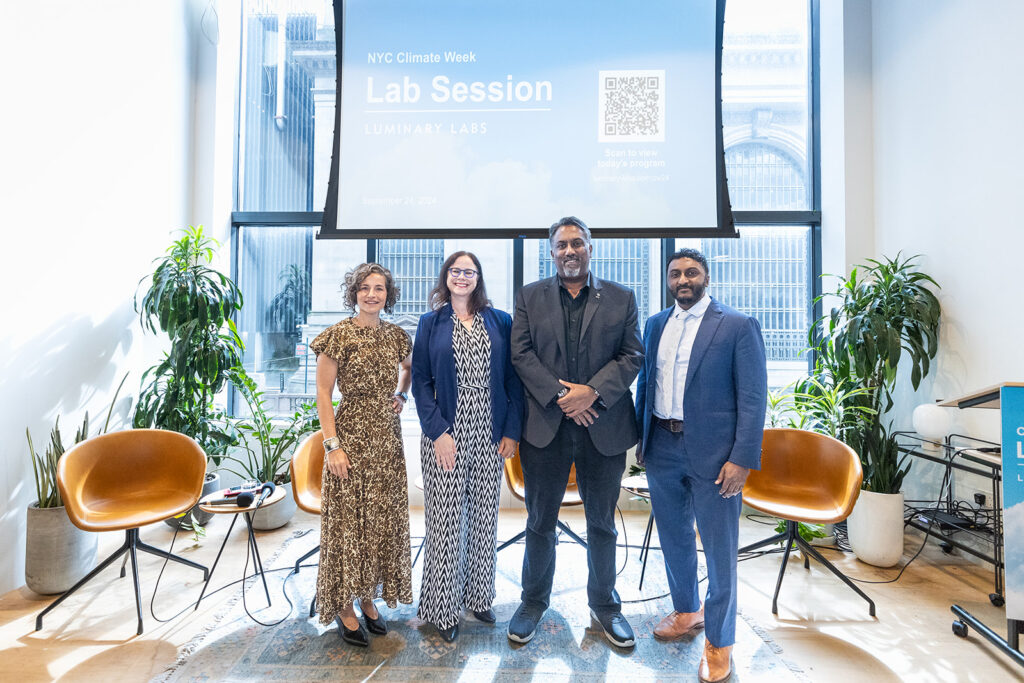 The panelists posing in front of the stage. From left to right: Sara Holoubek, Sarah Kaufman, ​Paul Cherukuri, Ph.D., and Dr. Chethan Sarabu.